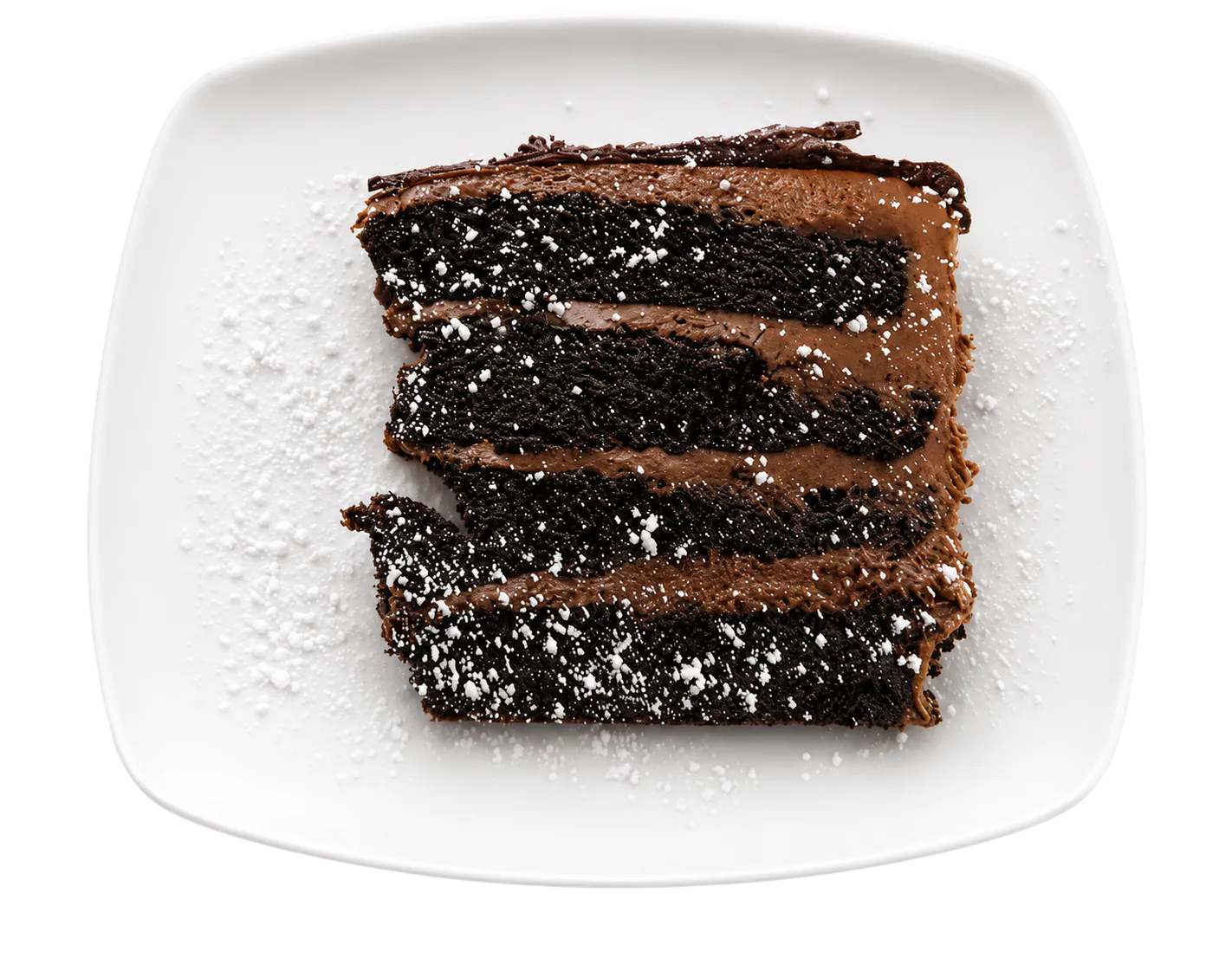 Slice of layered chocolate cake with chocolate frosting and powdered sugar on a white plate.